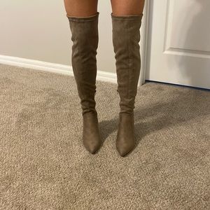 Knee high suede boots. Never worn.